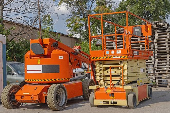 warehouse forklift in operation with stacked inventory in Bolton